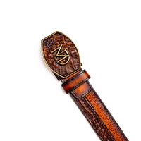 Detailed view of belt texture showing contrast between caiman crocodile skin and calf leather with stitched edges.