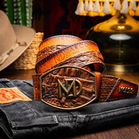 Model wearing Texas Western belt with caiman crocodile skin in aged maple, styled with jeans.