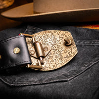 Side view of Texas Belt worn with rolled-up jeans highlighting belt details