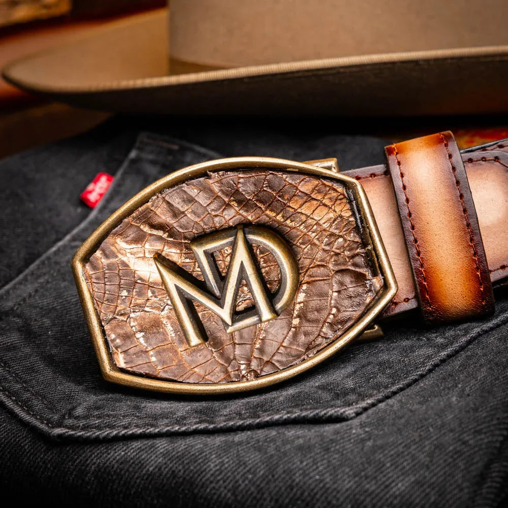 Model showcasing Texas Belt with layered outfit, emphasizing contrast between caiman skin and calf leather.