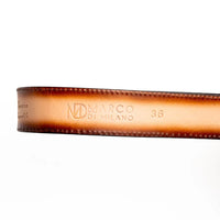 Side view of Texas Belt displaying antique-finish Western buckle and contrasting leather textures.