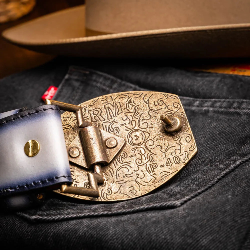Casual outfit featuring Texas stone gray belt complementing denim and boots.