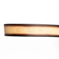 Detailed view of branded Marco Di Milano hot-stamped leather on Texas western belt.