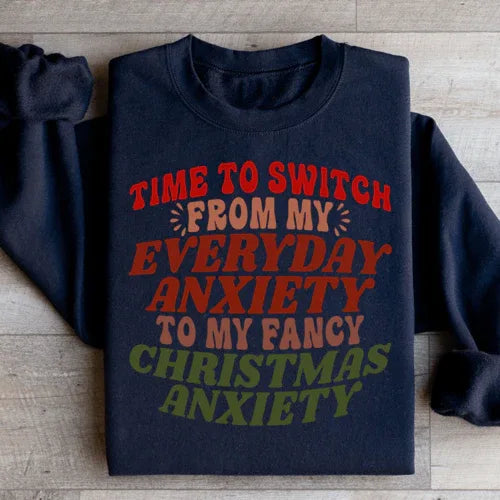 Close-up of black sweatshirt showing the white motivational quote on front with soft fleece fabric texture.