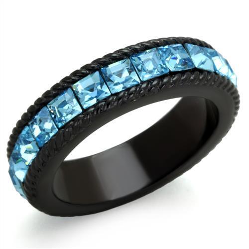 Close-up of black ion plated stainless steel ring with sea blue top grade crystal center stone on white background.