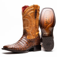 Close-up of Tucson cowboy boot showing textured caiman belly skin and square toe in aged maple color.