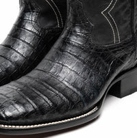 Close-up of the boot's upper showing detailed texture and craftsmanship in black caiman skin.