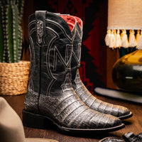 Lifestyle image of Tucson Stone Gray boot worn with jeans, emphasizing rugged Western style.