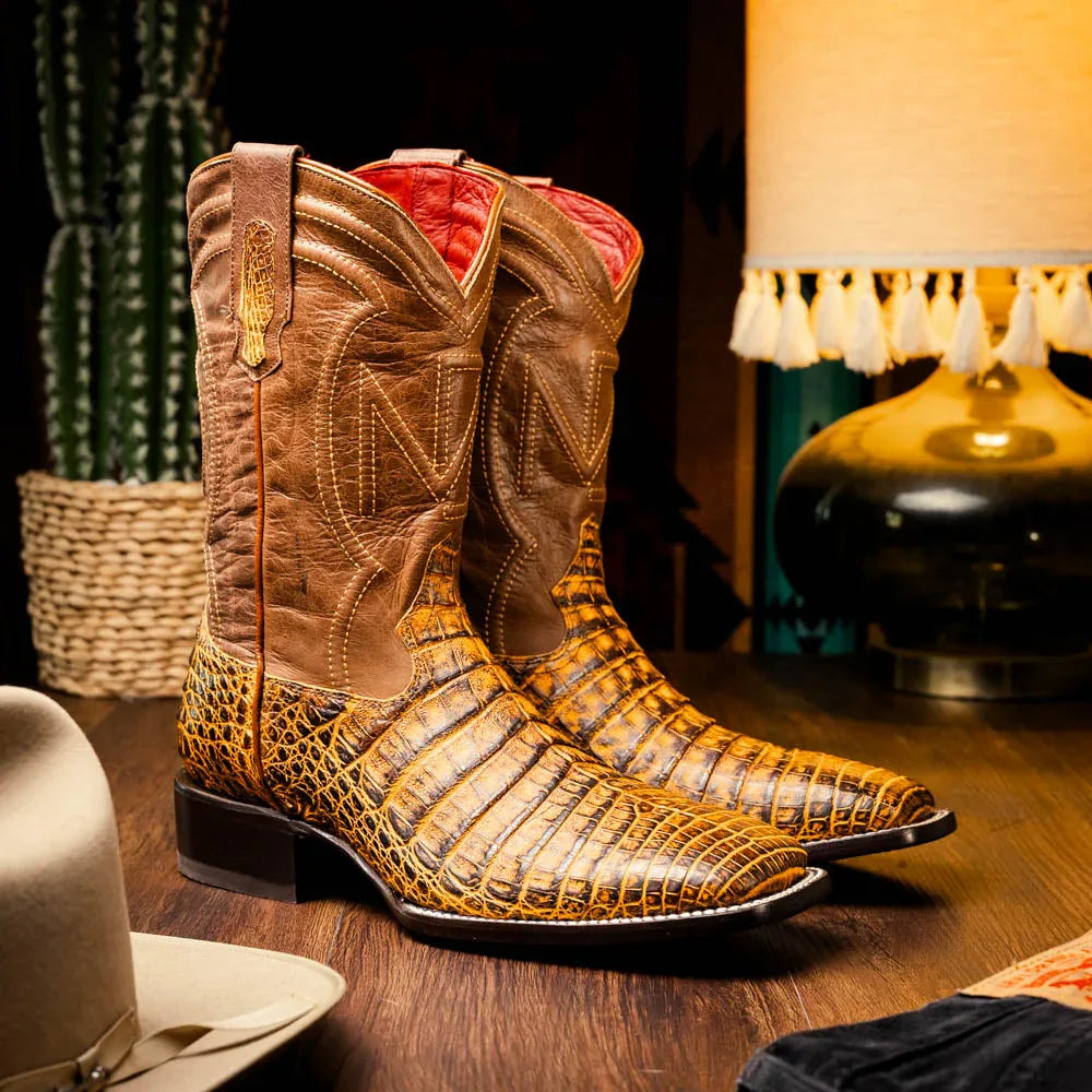 Lifestyle image showing Tucson Mustard Brown cowboy boots styled with casual western outfit outdoors.