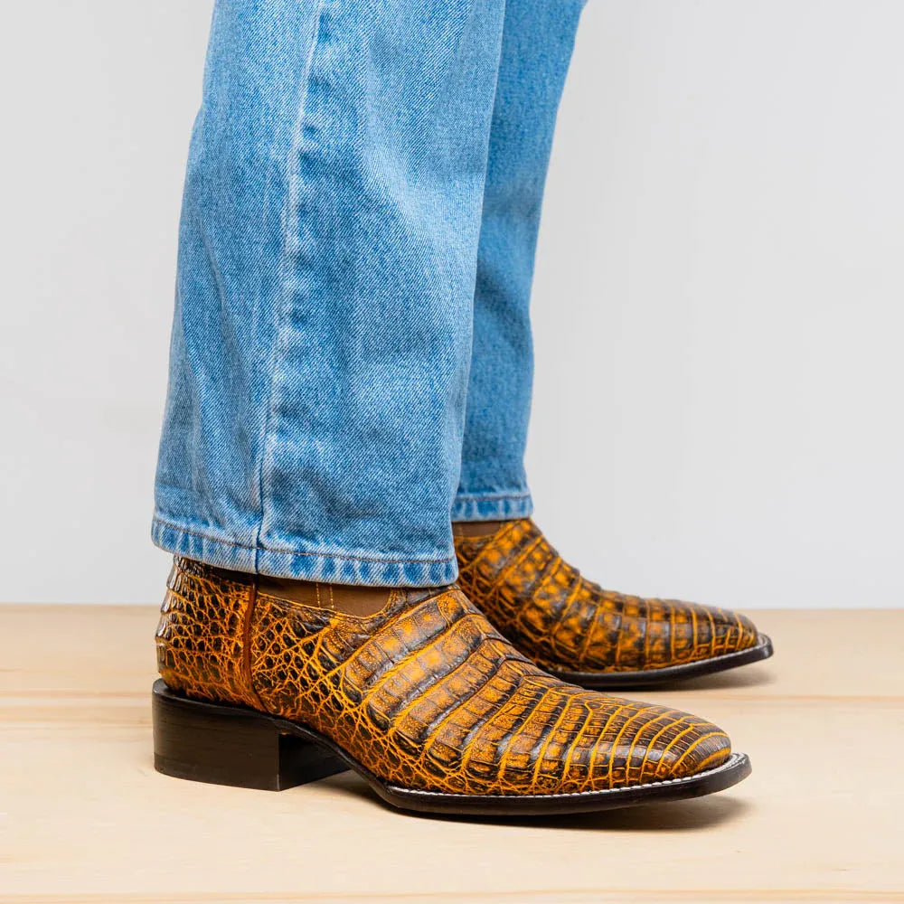 Tucson Mustard Brown cowboy boot on foot, paired with jeans showing boot's profile and shape.