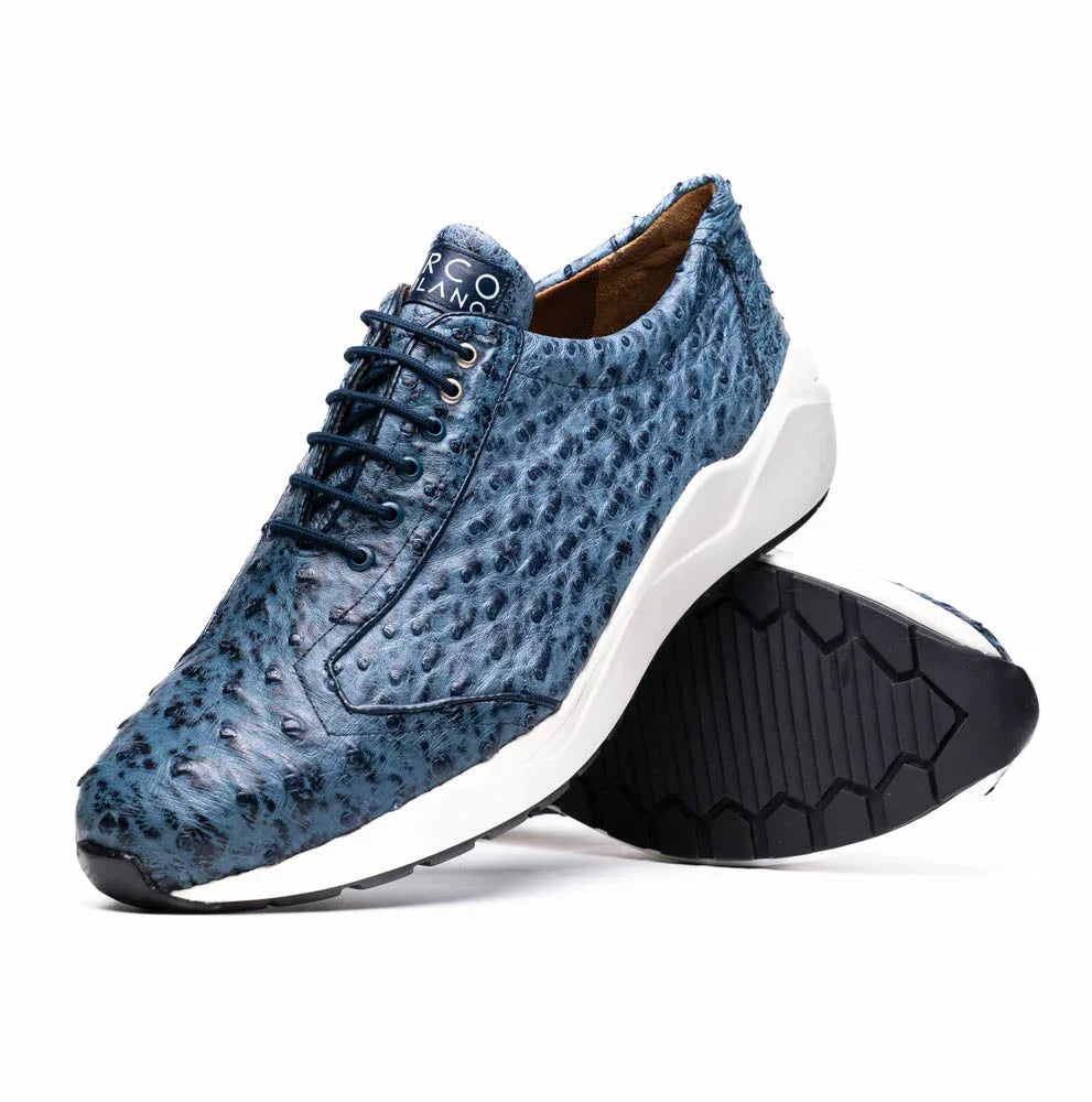 Side view of handcrafted navy blue ostrich leather sneaker highlighting elegant design and fine texture.